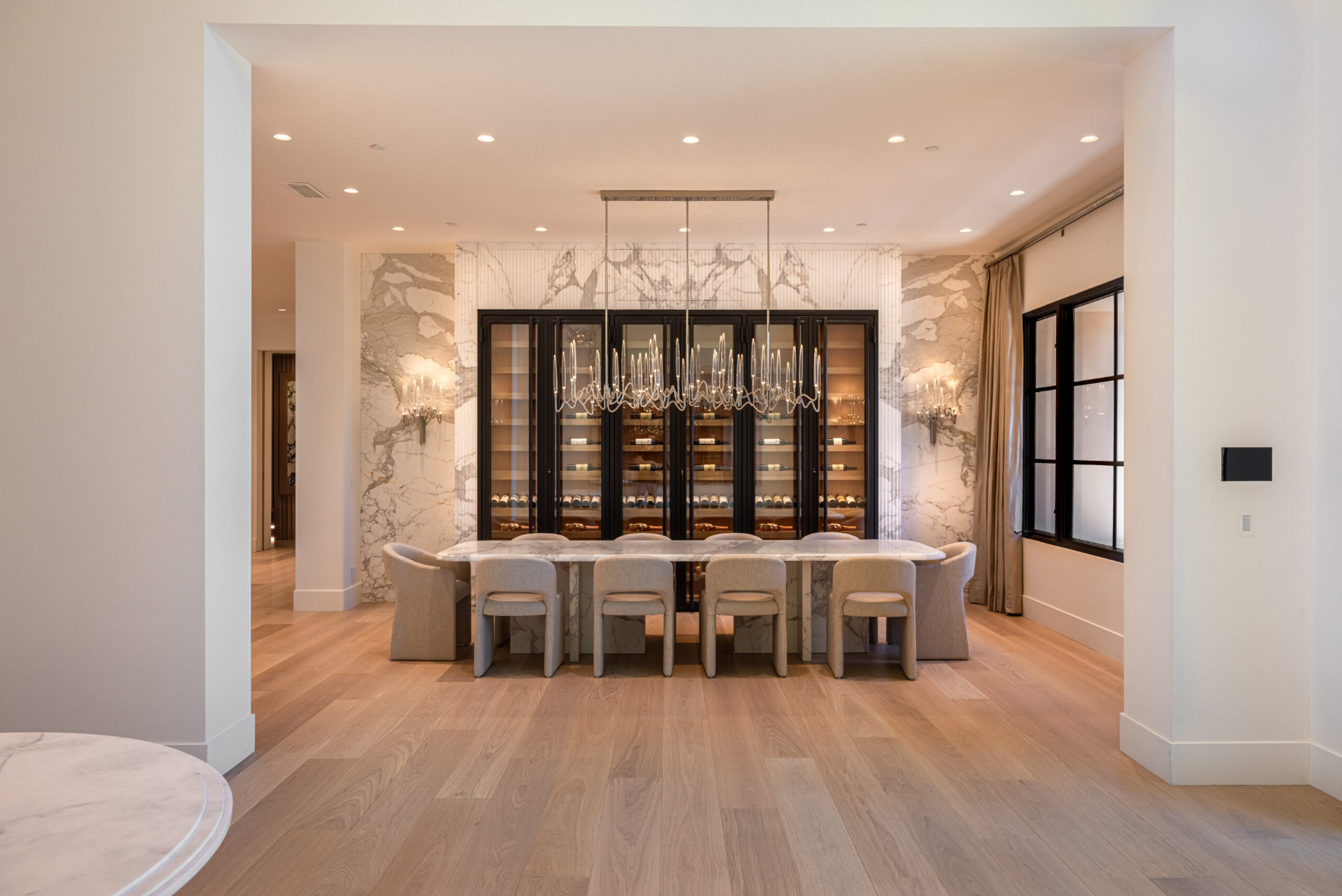 Full view of white oak wine cellar in dining room in Rancho Santa Fe California