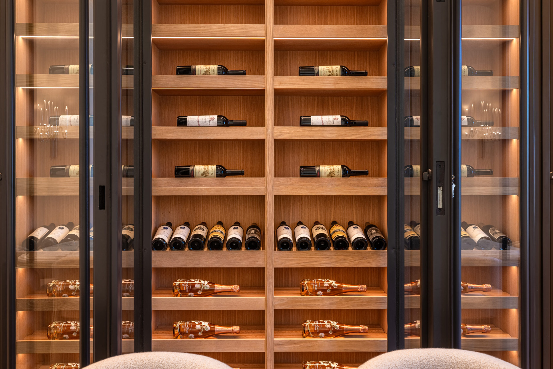 Horizontal display white oak wine cellar with sliding glass doors in Rancho Santa Fe California