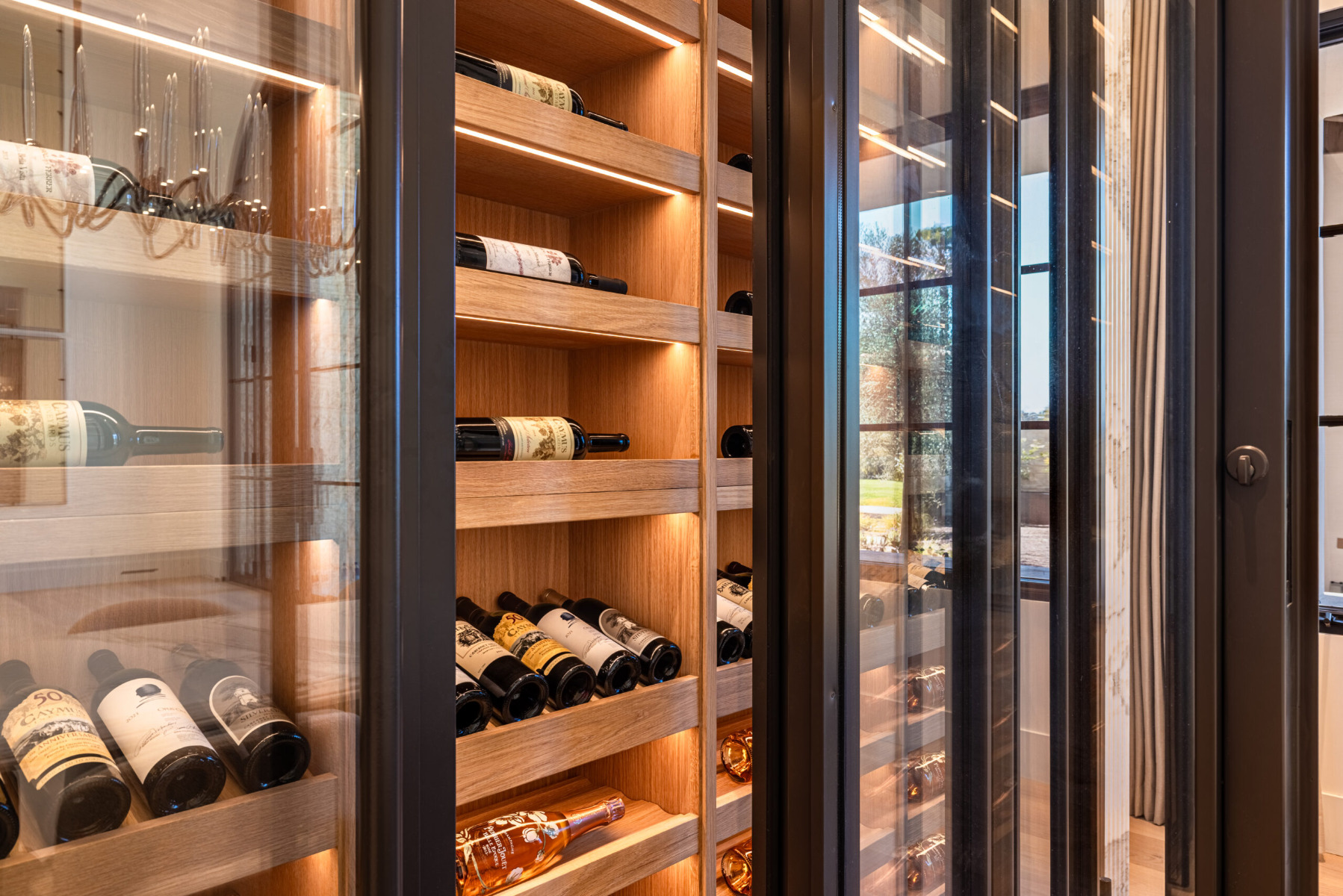 White oak wine cellar with lighting in Rancho Santa Fe California